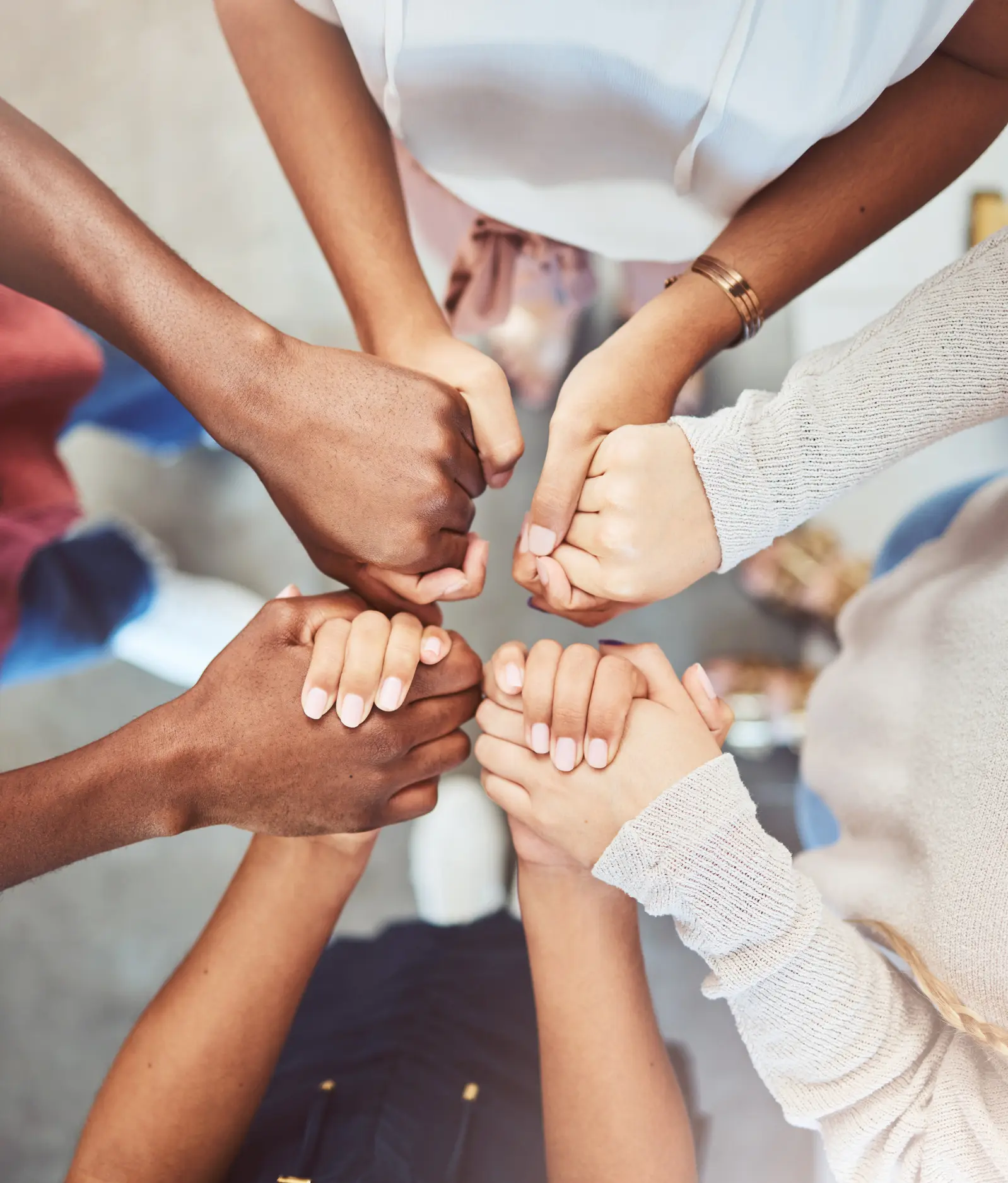 Support, prayer and trust with people holding hands in counseling for mental health, wellness or teamwork. Worship, hope and community group therapy for help, solidarity or spiritual faith from above