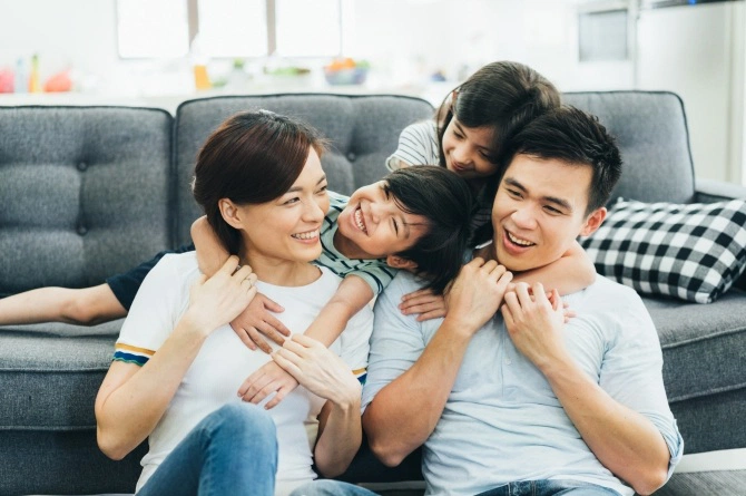 family-happy-couch-together